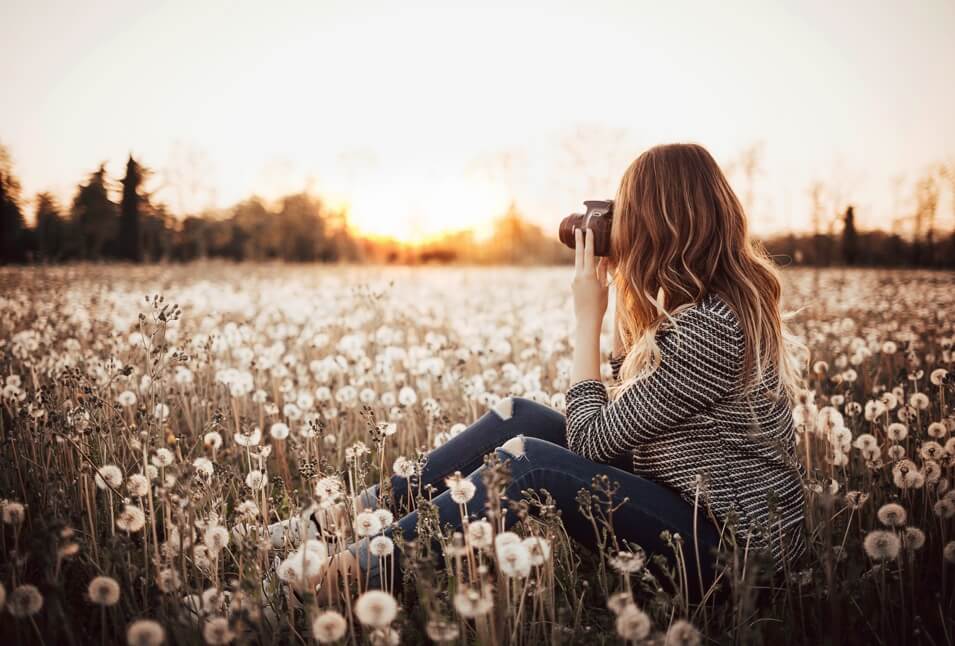 Women taking picture in the flower field